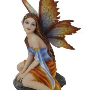 Fée jaune et bleue à califourchon sur un rocher - 9x16cm